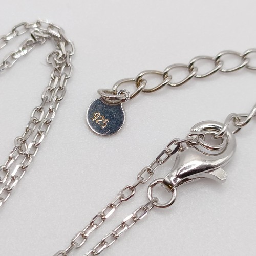 774 - A silver chain, with an oval rubover set cubic zirconia stone