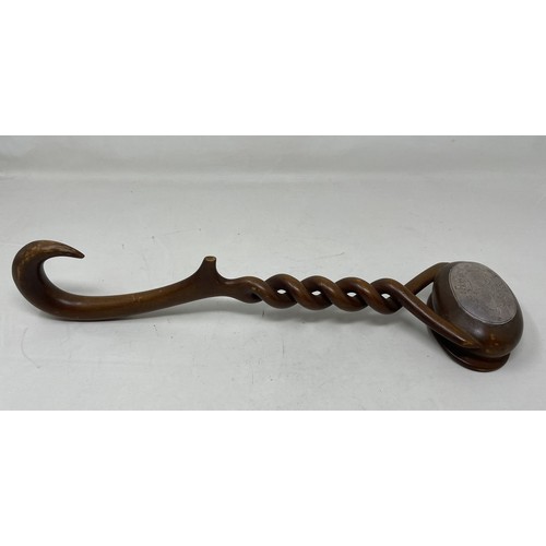 1112 - A late 18th/early 19th Century carved treen punch ladle, from a single piece of wood, the bowl inset... 