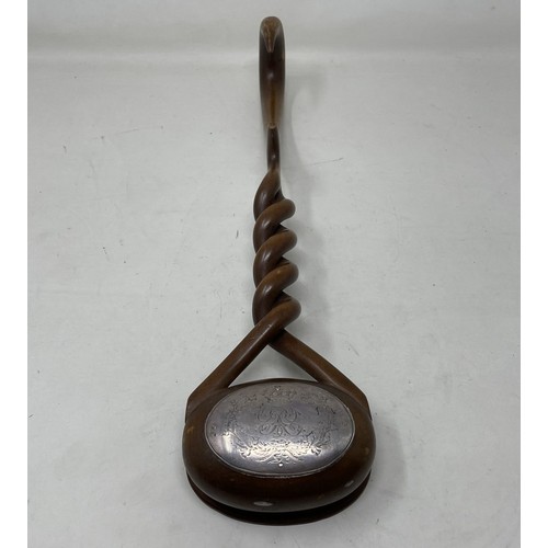 1112 - A late 18th/early 19th Century carved treen punch ladle, from a single piece of wood, the bowl inset... 