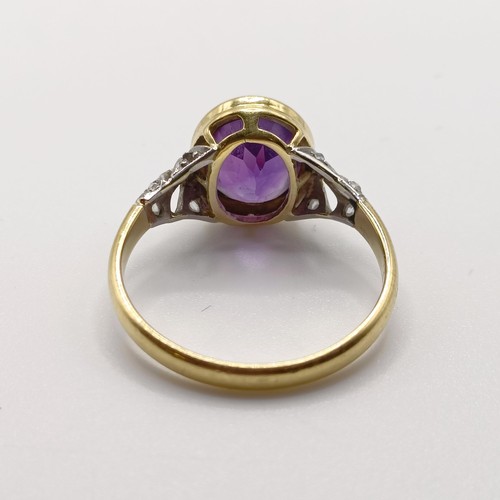 789 - A 18ct yellow gold, amethyst and rose cut diamond dress ring, with pierced design sides