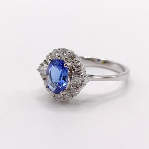 788 - An 18ct white gold, AA tanzanite and diamond ring, oval tanzanite 1.26ct, RBC and tapered baguette d... 