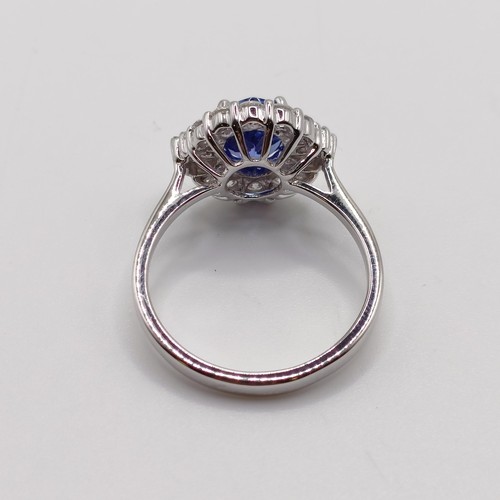 788 - An 18ct white gold, AA tanzanite and diamond ring, oval tanzanite 1.26ct, RBC and tapered baguette d... 