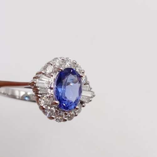 788 - An 18ct white gold, AA tanzanite and diamond ring, oval tanzanite 1.26ct, RBC and tapered baguette d... 