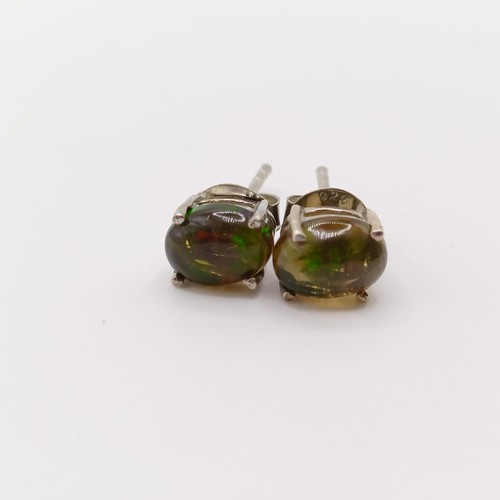 859 - A pair of Ethiopian black opal studs, in silver