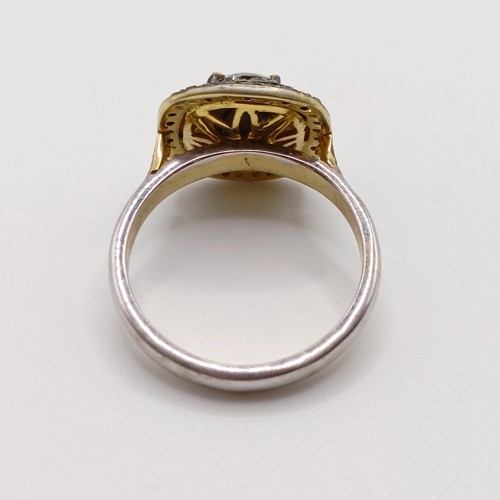 802 - A silver gilt dress ring, set with a central fancy brown rose cut cushion shaped diamond, and two ha... 