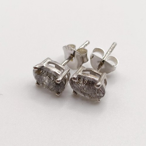 857 - A pair of rutilated quartz studs, in silver