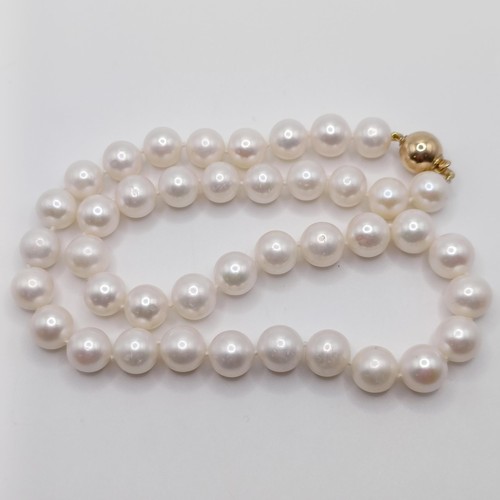 746 - A cultured pearl strung necklace, with a 9ct yellow gold ball clasp