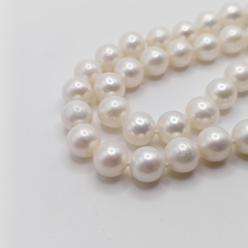 746 - A cultured pearl strung necklace, with a 9ct yellow gold ball clasp