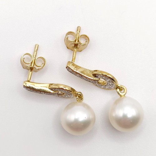 733 - A pair of Art Deco style 9ct yellow gold drop earrings, set with round cultured freshwater pearls an... 