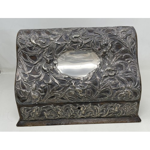 1137 - An Art Nouveau silver mounted stationery box, with embossed decoration, London 1901,  30 cm wide