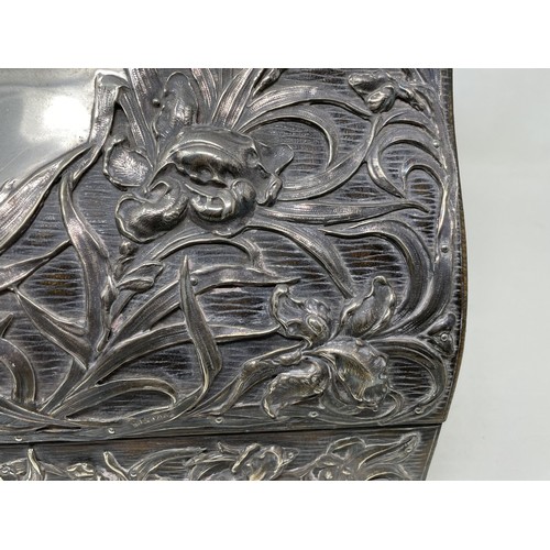 1137 - An Art Nouveau silver mounted stationery box, with embossed decoration, London 1901,  30 cm wide