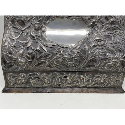 1137 - An Art Nouveau silver mounted stationery box, with embossed decoration, London 1901,  30 cm wide