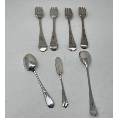 1180 - A set of four silver Old English pattern forks, a butter knife and two spoons, various dates and mar... 