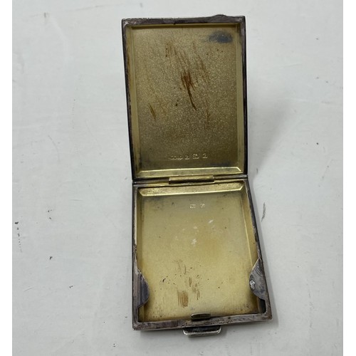 1202 - A silver cigarette case, two spoons and a lid, various dates and marks, 2.6 ozt Provenance:  Sold on... 