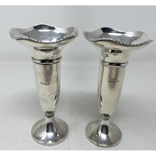 1214 - A pair of Edward VII silver vases, Sheffield 1904, bases filled