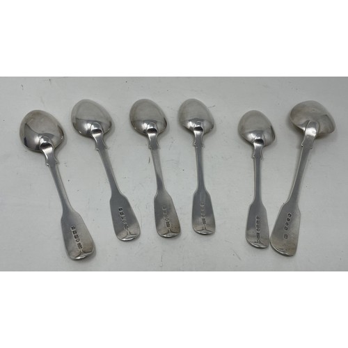 1224 - A Victorian silver fiddle pattern serving spoon, and five dessertspoons, various dates and marks, 8.... 