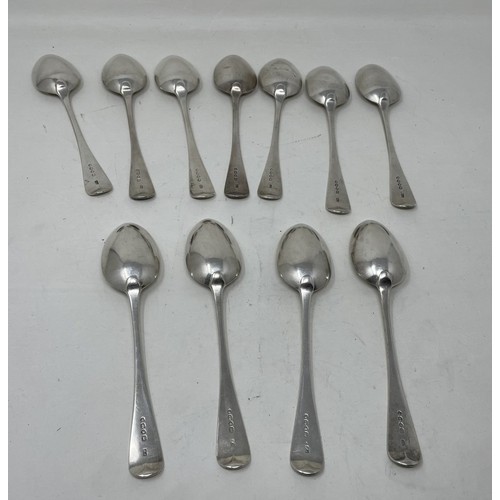 1238 - A set of eleven Victorian silver Old English pattern dessertspoons, London 1862, 17.1 ozt