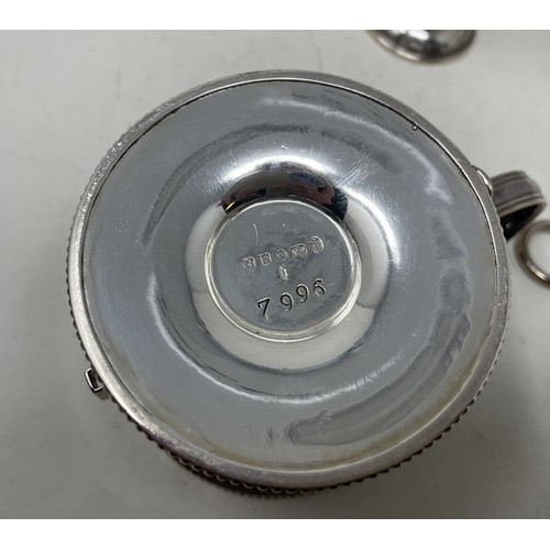 1252 - A silver coloured metal table lighter, and a silver plated chamberstick (2)