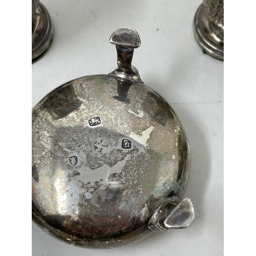 1260 - A set of four silver salts, lacking blue glass liners, a pair of salt spoons, weighable silver 6.5 o... 