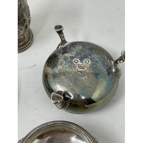 1260 - A set of four silver salts, lacking blue glass liners, a pair of salt spoons, weighable silver 6.5 o... 