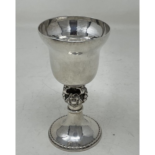 1286 - A silver goblet, with hammered decoration, on a fruit stem, Omar Ramsden, London 1938, 5.6 ozt, 12 c... 