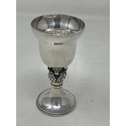 1286 - A silver goblet, with hammered decoration, on a fruit stem, Omar Ramsden, London 1938, 5.6 ozt, 12 c... 