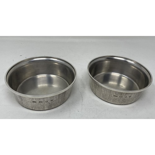 1303 - A pair of silver modernist dog bowls, Christopher Lawrence, London 1975, 11.8 ozt,13 cm diameter