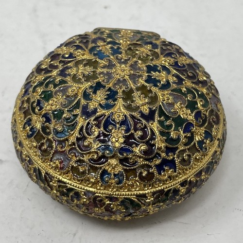 1320 - A gilt metal and plique a jour box, 5 cm diameter