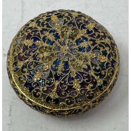 1320 - A gilt metal and plique a jour box, 5 cm diameter