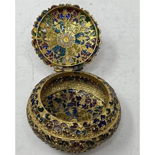 1320 - A gilt metal and plique a jour box, 5 cm diameter