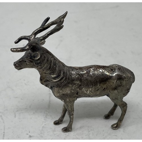 1328 - A silver coloured metal figure of a stag, 6 cm