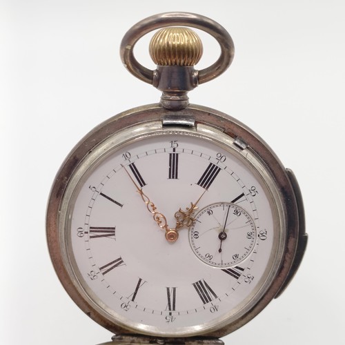 1017 - A silver coloured metal hunter pocket watch, with repeat, engraved an armorial