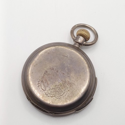 1017 - A silver coloured metal hunter pocket watch, with repeat, engraved an armorial