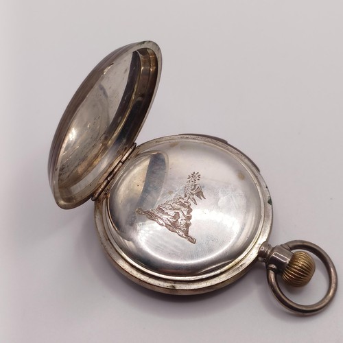 1017 - A silver coloured metal hunter pocket watch, with repeat, engraved an armorial