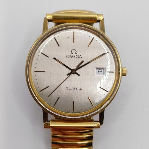 1019 - A gentleman's Omega Quartz wristwatch, with baton indices and date, on a later expanding bracelet