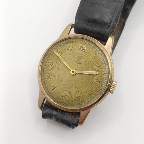 1027 - A gentleman's 9ct gold Tudor wristwatch, on a leather strap