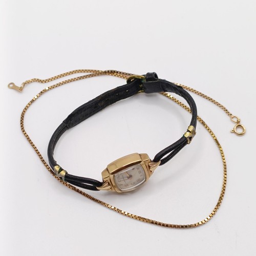 1028 - A ladies yellow coloured metal wristwatch, on a leather strap, and a 9ct gold chain, 4.4 g