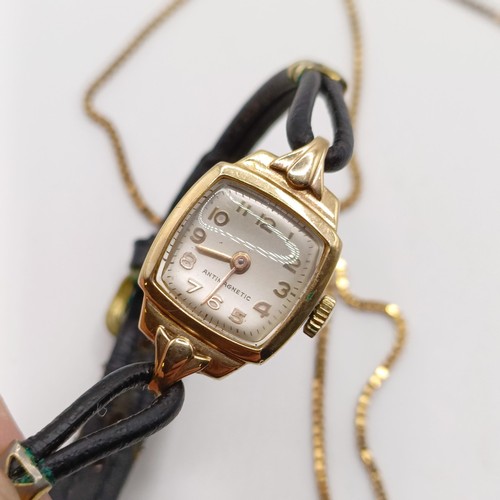 1028 - A ladies yellow coloured metal wristwatch, on a leather strap, and a 9ct gold chain, 4.4 g