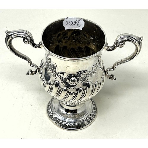 1304 - A 19th century Irish silver two handled cup, with embossed decoration, marks rubbed, 13.9 ozt, 15 cm... 