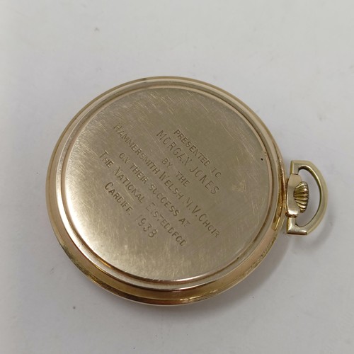 1032 - A 9ct gold open face pocket watch, with a presentation inscription dated 1938