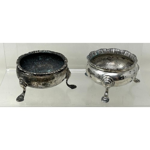 1342 - A pair of George III silver salts, on three pad feet, marks indistinct, another similar, and another... 