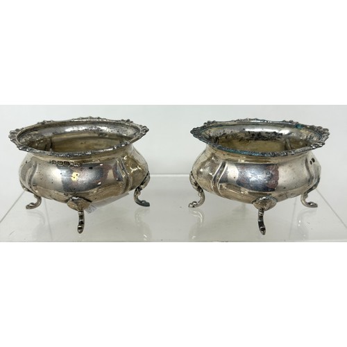 1346 - A set of four silver salts, of shaped oval form, Sheffield 1929, and a set of eight silver fiddle pa... 