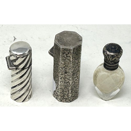 1356 - A Victorian silver scent bottle holder, another, and a cut glass scent bottle with a silver mount (3... 