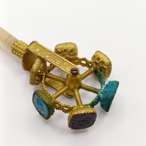 854 - A 19th century gilt metal revolving seal, with a mother of pearl handle