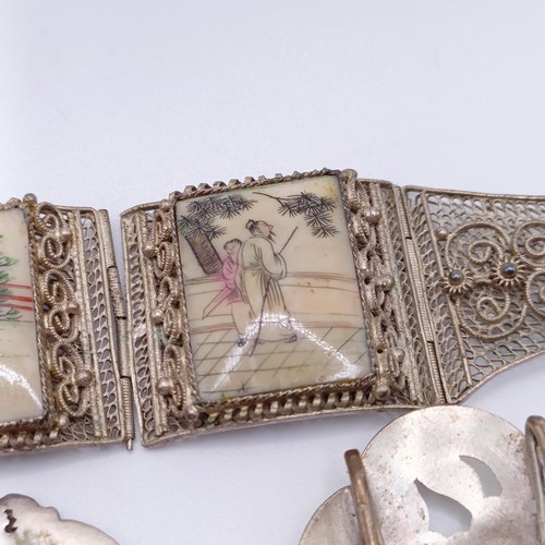 856 - A silver coloured metal buckle, decorated a bird, and assorted costume jewellery