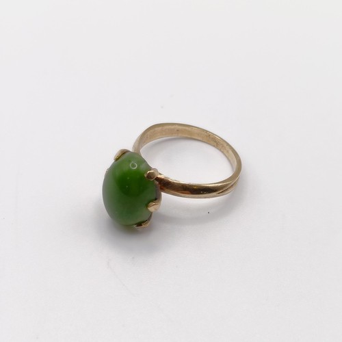 826 - A New Zealand green jade ring, ring size M