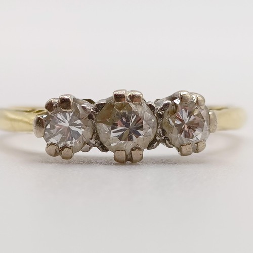 799 - An 18ct gold and three stone diamond ring, ring size M