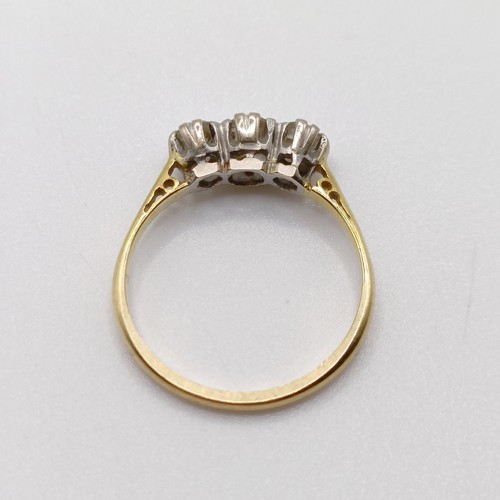 799 - An 18ct gold and three stone diamond ring, ring size M