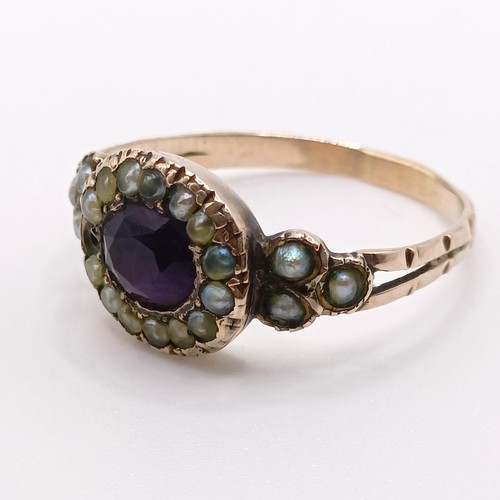 785 - A 19th century yellow metal, seed pearl and amethyst stone ring, ring size M