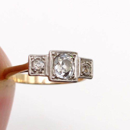 840 - An Art Deco diamond three stone ring, ring size O